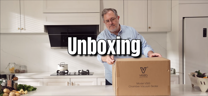 A picture of a man opening a large brown cardboard box with the word Unboxing overlayed.