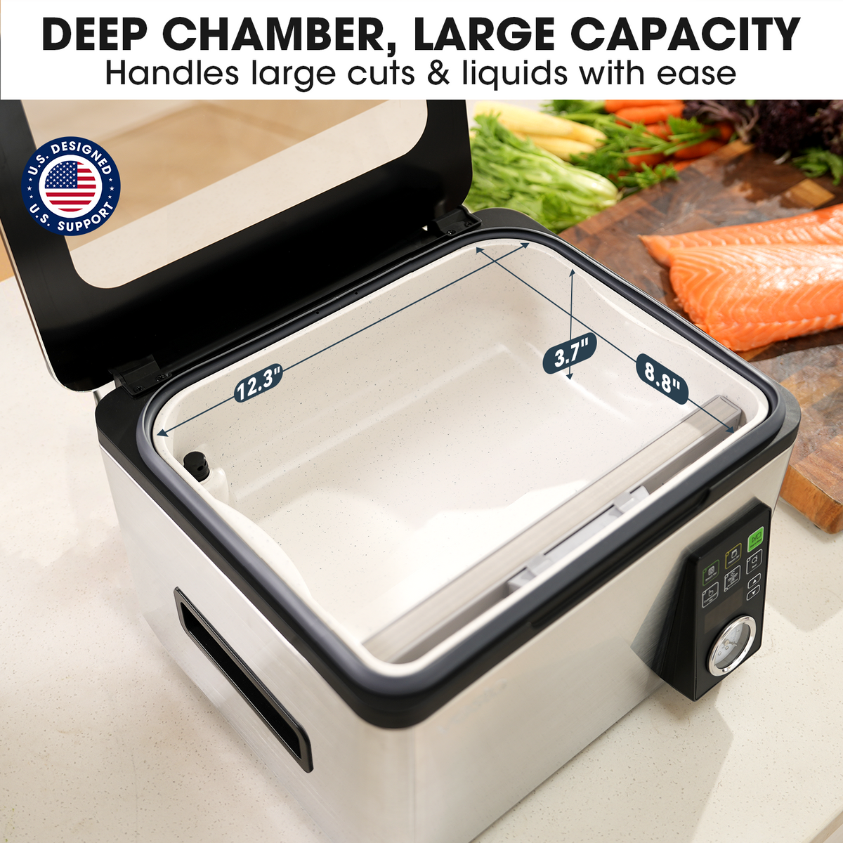 Picture of the deep chamber with dimensions for handling large cuts and liquids, shown on a kitchen counter with vegetables and salmon.
