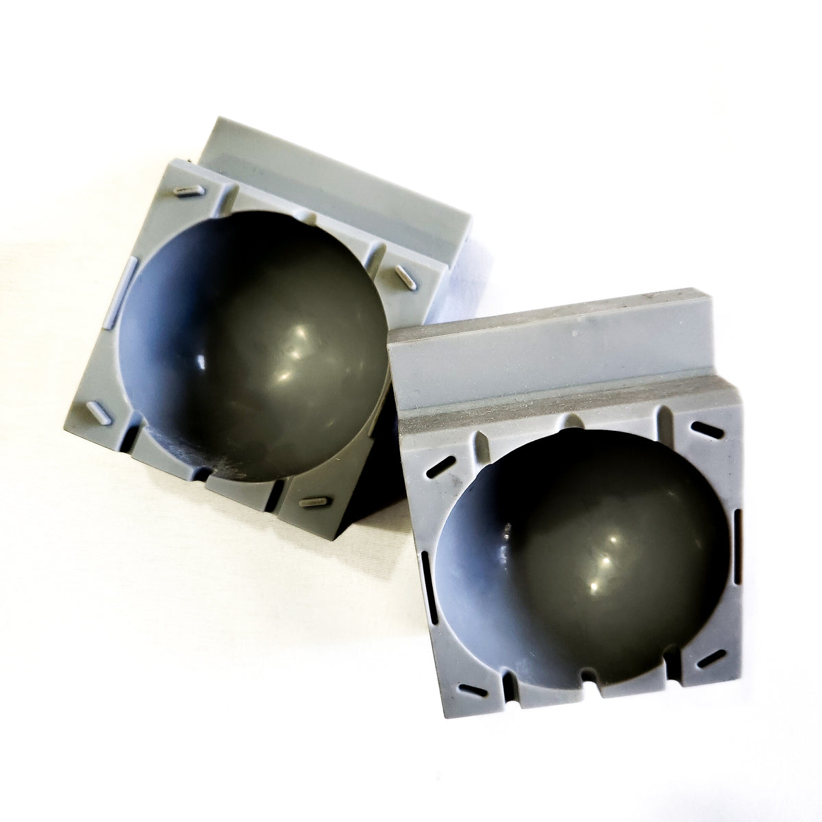 A picture of the grey silicone 75mm sphere mold halves. 