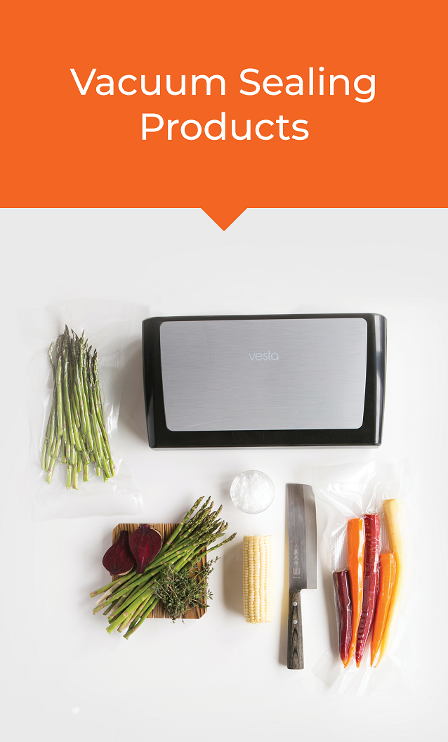 An overhead view of a vacuum sealer with vacuum sealed vegetables.