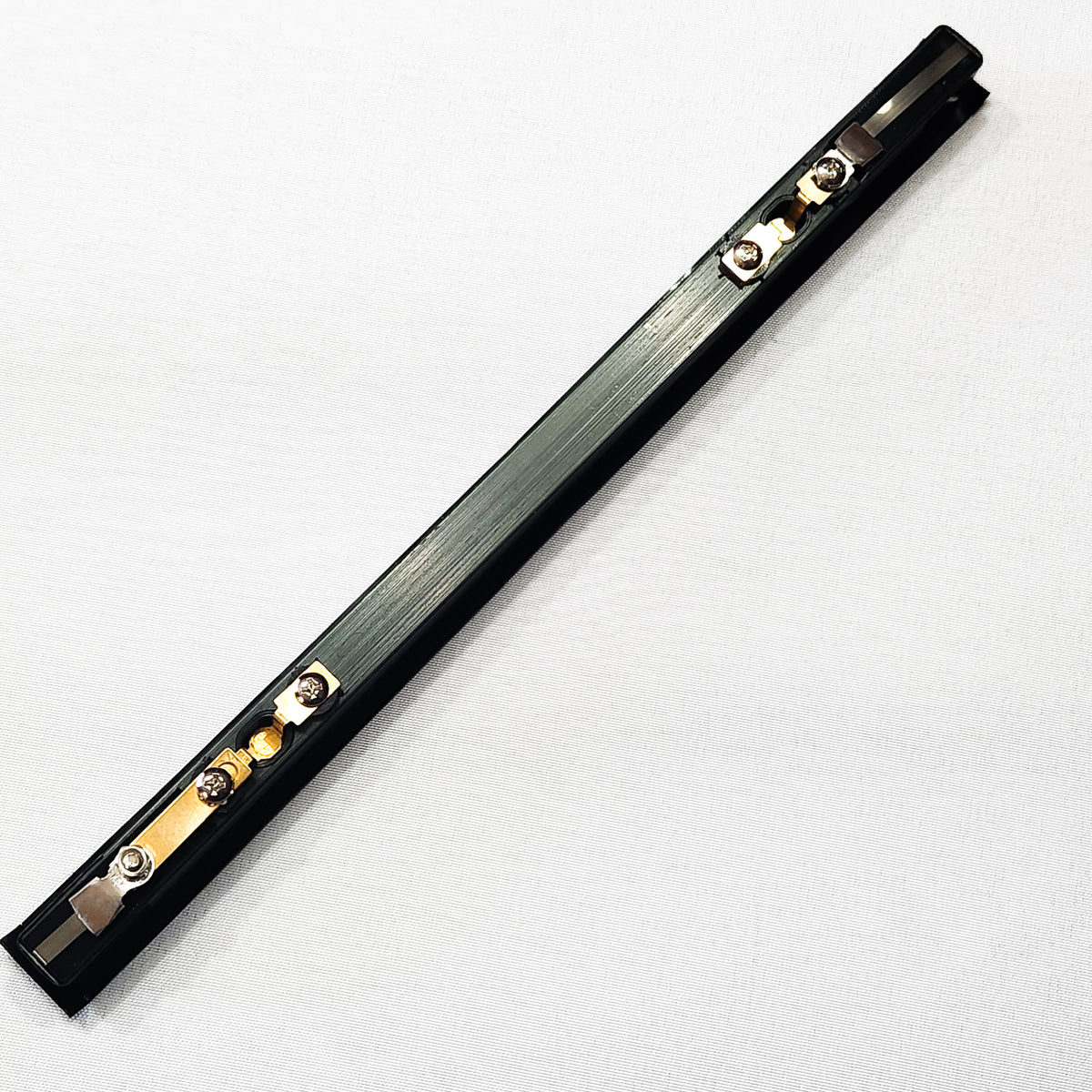 A picture of the seal bar for the V30 Chamber Vac Elite, a black thin rectangular bar with the brass contacts visible on the underside of the bar.