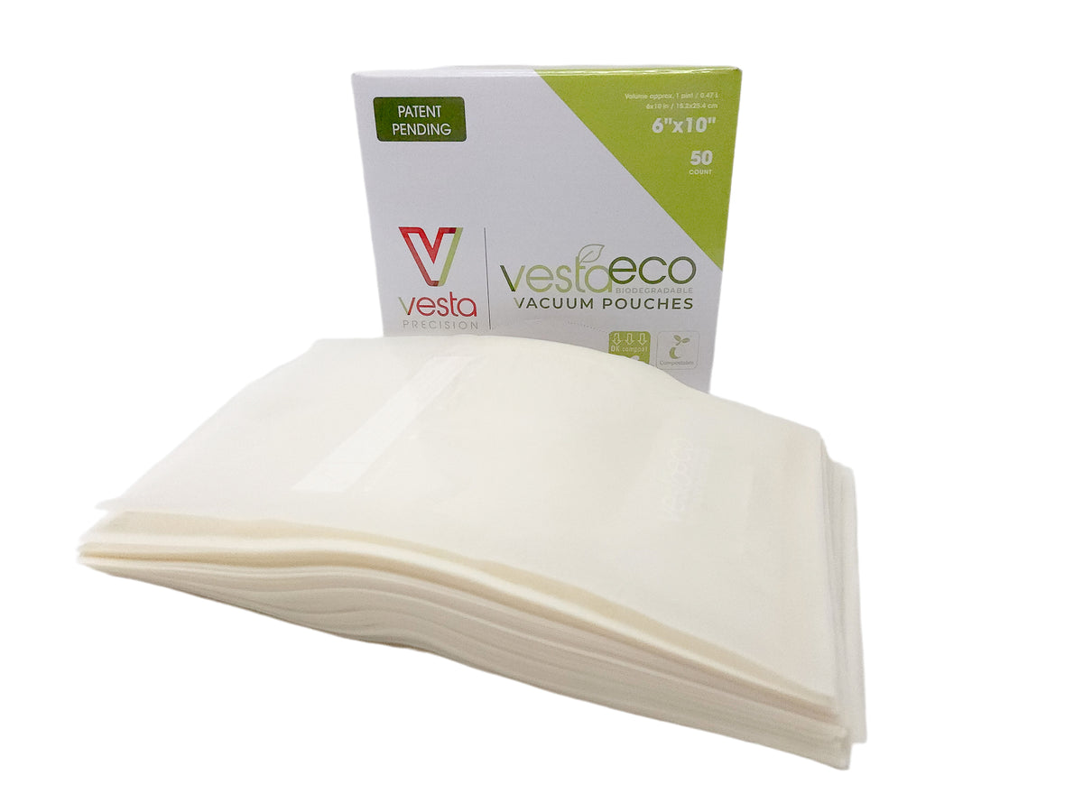 A picture of a box of fifty 6x10 inch VestaEco certified commercially compostable embossed vacuum seal bags.