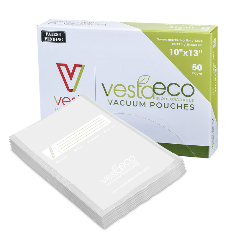 A picture of a box of fifty 10x13 inch VestaEco certified commercially compostable flat chamber vacuum seal bags.